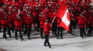 Hayley Wickenheiser leads Team Canada into the opening ceremony of the Sochi 2014 Olympic Winter Games