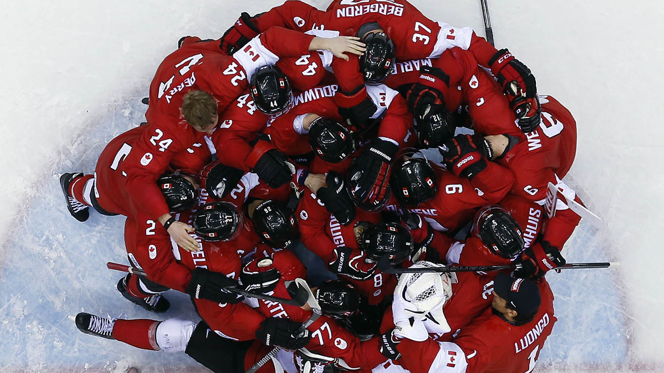 overhead view of hockey players huddled together