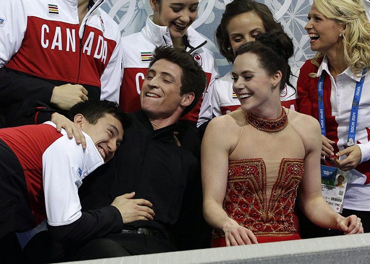 Patrick Chan and Team Canada wait with Tessa and Scott to see their results