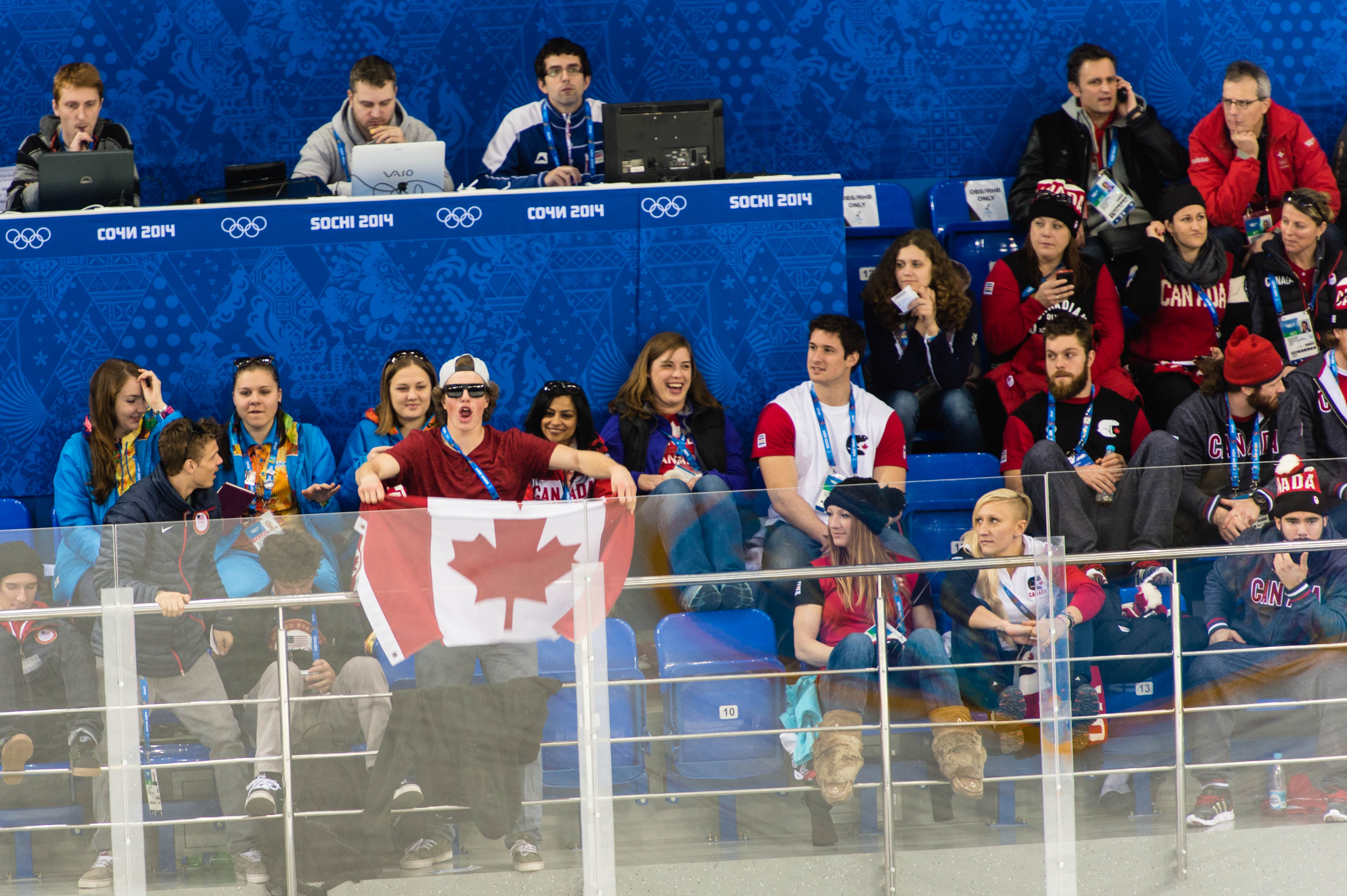 Fellow Canadian athletes cheer on the Women's Hockey Team.