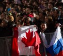 Fans holding up the Canadian flag