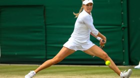Eugenie gets prepared to return a shot via backhand