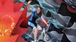 Hughes riding on to the stage at the end of her 110-day bike tour of Canada for ending the stigma surrounding mental health.