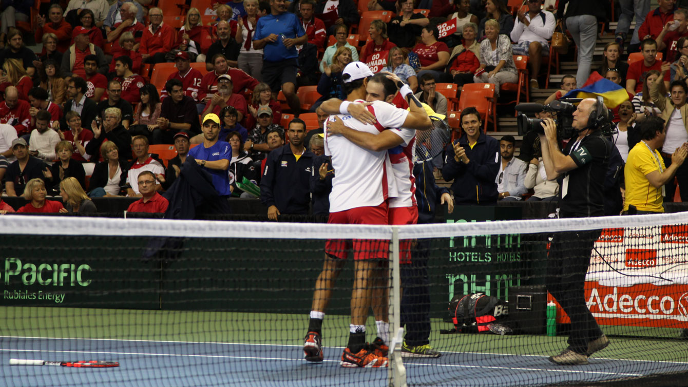 Juan Sebastian Cabal and Robert Farah embrace after keeping Colombia alive in their Davis Cup tie versus Canada. 