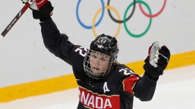 Hayley Wickenheiser raises her arms in celebration