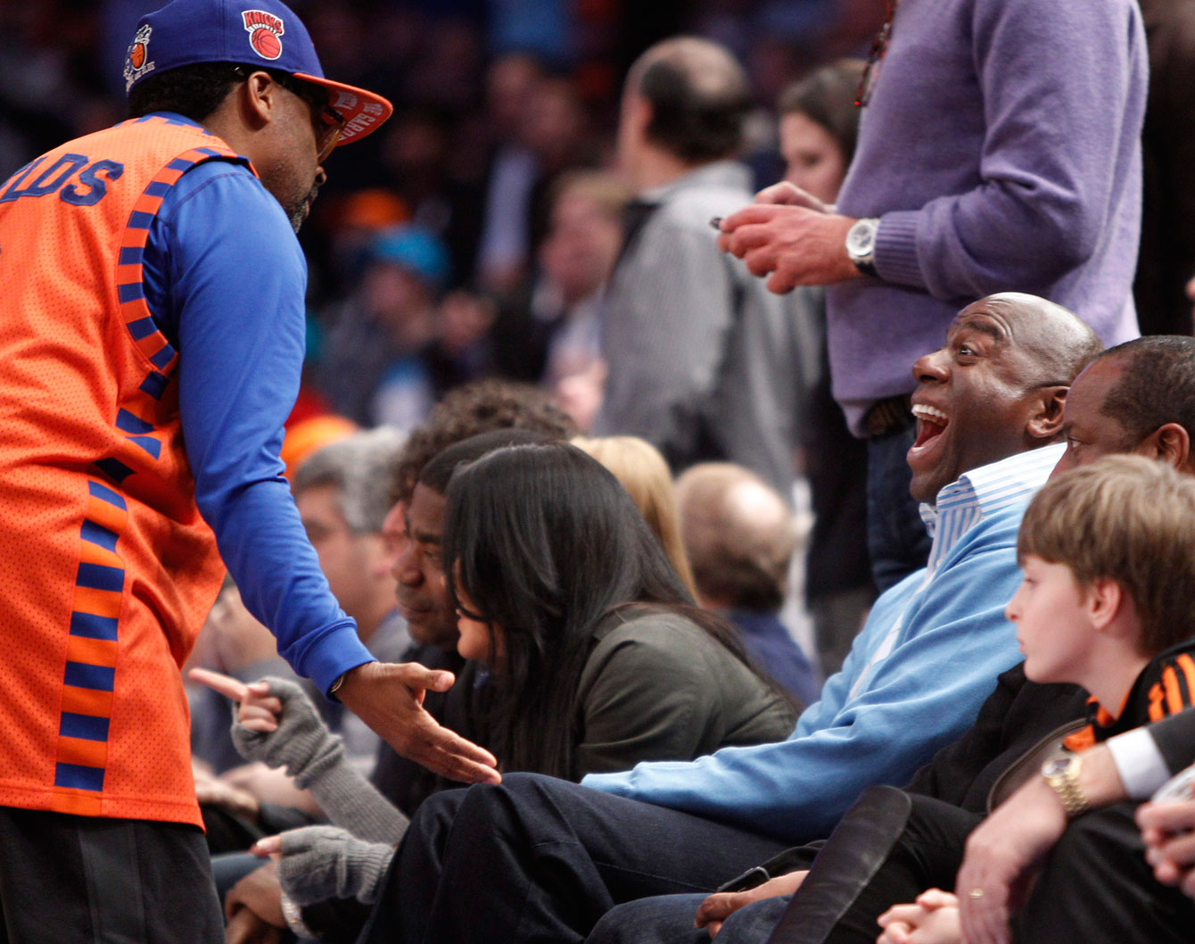 Spike enjoys a laugh with Magic Johnson. Photo: CP