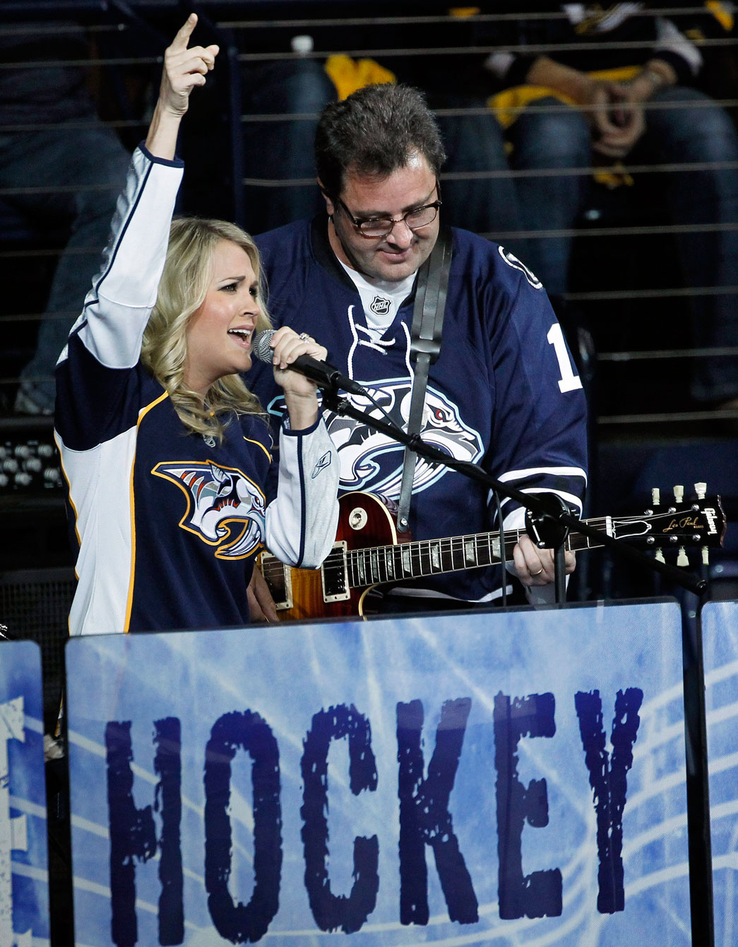 Underwood and Vince Gill performing during an intermission at a Predators playoff game in 2011. Photo: CP