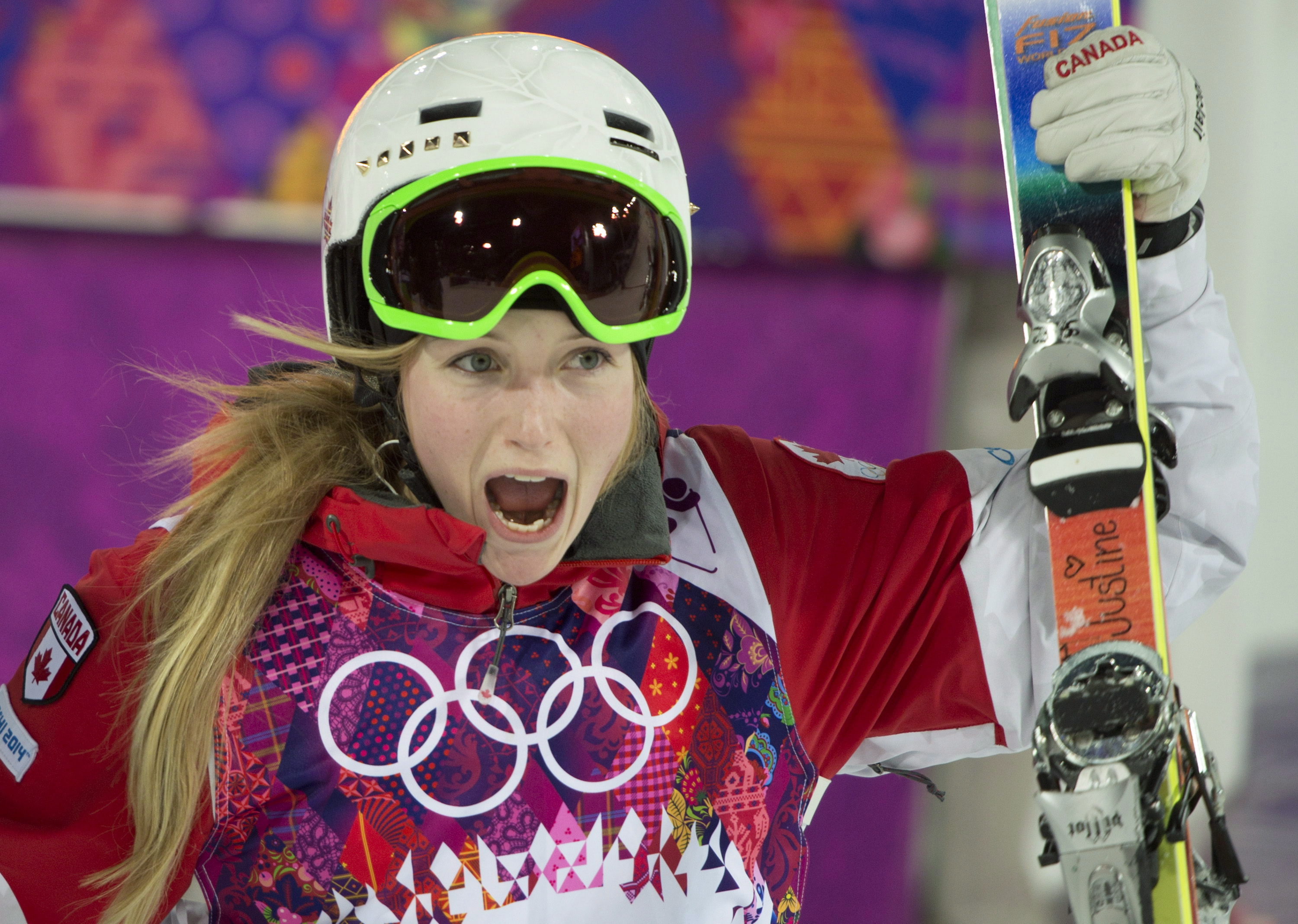 Justine Dufour-Lapointe celebrates her gold medal in women's moguls