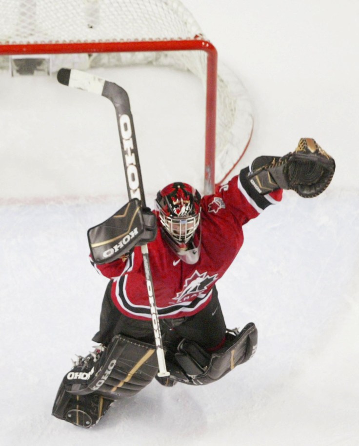 Goalie Jeff Glass races to celebrate the gold medal win with his teammates (Photo: CP)