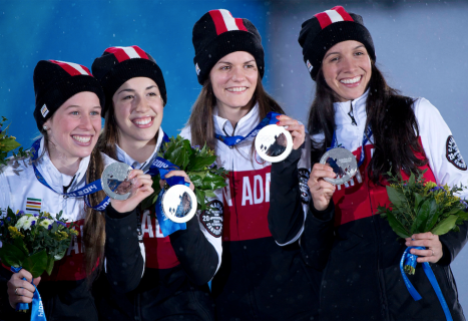 (From left to right) Marianne St-Gelais, Valérie Maltais, Jessica Hewitt and Marie-Ève Drolet receive their Sochi 2014 silver medal for the 3000m relay. (Photo: CP)