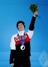 Men's 500-meter short track speedskating bronze medalist Charle Cournoyer of Canada celebrates during the medals ceremony at the 2014 Winter Olympics, Saturday, Feb. 22, 2014, in Sochi, Russia. (AP Photo/David Goldman)