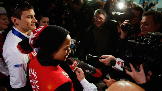 Morrison & Junio - Sochi 2014 Morrison (left) and Junio meet an awaiting Canadian media at the airport upon their return from Sochi.