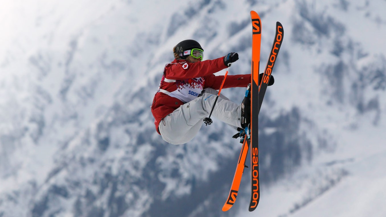 Dara Howell - Sochi 2014 Dara Howell grabs the front of her skis on way to landing the final jump of her winning run at Sochi 2014.