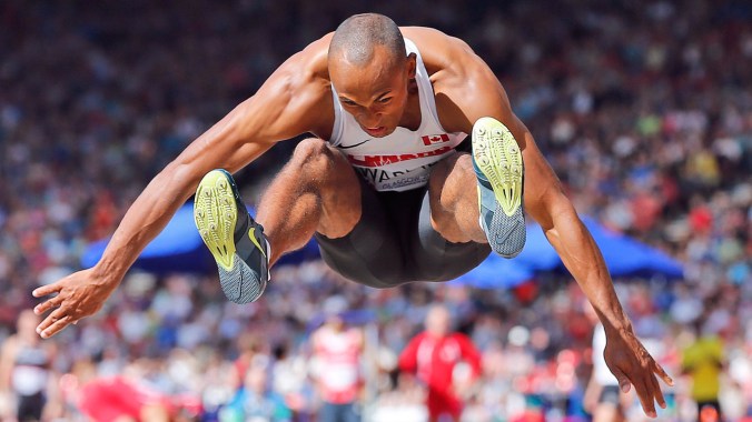 Damian Warner - Glasgow 2014 Commonwealth Games Decathlon gold medallist Damian Warner takes flight during the long jump.