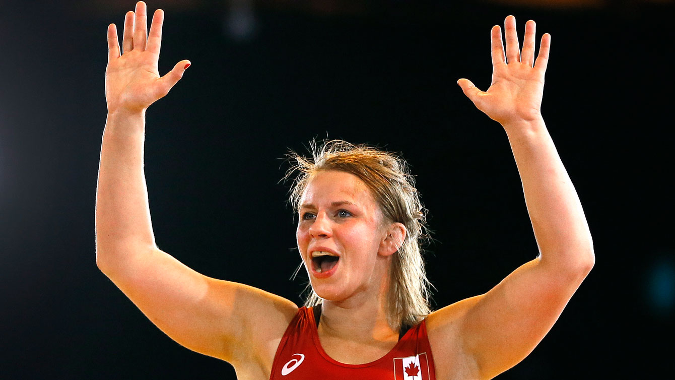 Erica Wiebe celebrates her wrestling gold medal at Glasgow 2014 Commonwealth Games.