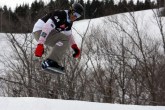Rob Fagan grabbing some air mid-race. (Photo: Canada Snowboard)