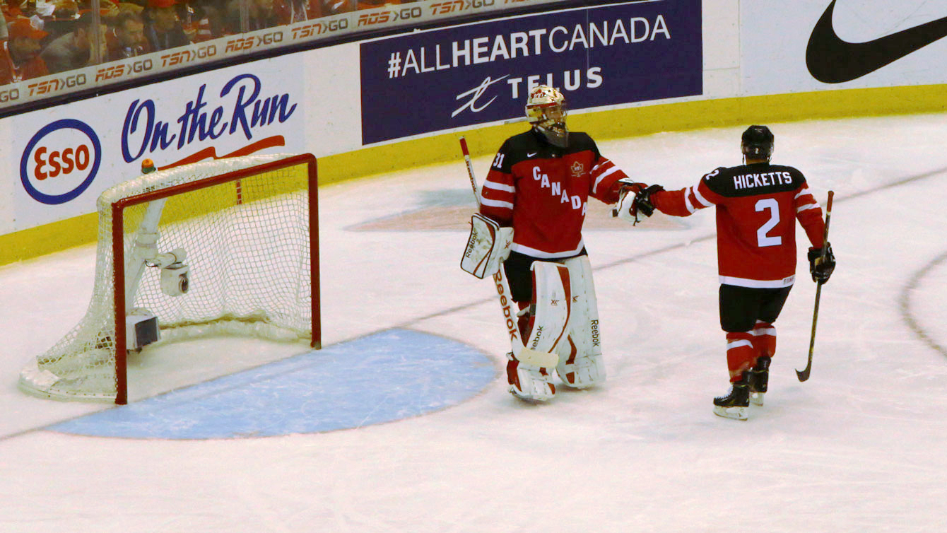 Zach Fucale acknowledges teammate Joe Hicketts after his key second period clearance while the Canadian goal was at Slovakia's mercy. 