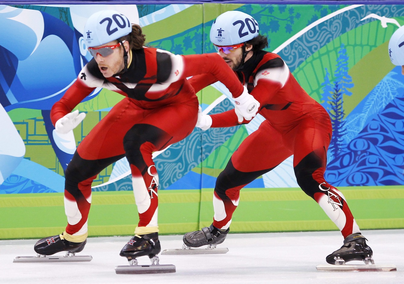One short track speed skater pushed another in a relay