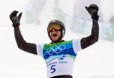 Jasey-Jay Anderson of Canada celebrates his gold medal run at the men's parallel giant slalom at Cypress Mountain in West Vancouver, B.C., Saturday February 27, 2010, at the 2010 Vancouver Olympic Winter Games. THE CANADIAN PRESS/Sean Kilpatrick