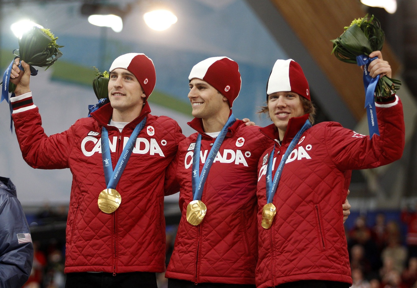 Team Canada's Denny Morrison, left, Lucas Makowsky, center, and Mathieu Giroux, right, are seen on the podium after winning the gold medal in the men's team pursuit final speed skating race at the Richmond Olympic Oval at the Vancouver 2010 Olympic Winter Games in Vancouver, British Columbia, Saturday, Feb. 27, 2010. (AP Photo/Matt Dunham)
