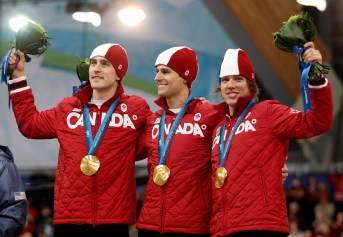 Vancouver Olympics Speed Skating Team Canada's Denny Morrison, left, Lucas Makowsky, center, and Mathieu Giroux, right, are seen on the podium after winning the gold medal in the men's team pursuit final speed skating race at the Richmond Olympic Oval at the Vancouver 2010 Olympic Winter Games in Vancouver, British Columbia, Saturday, Feb. 27, 2010. (AP Photo/Matt Dunham)