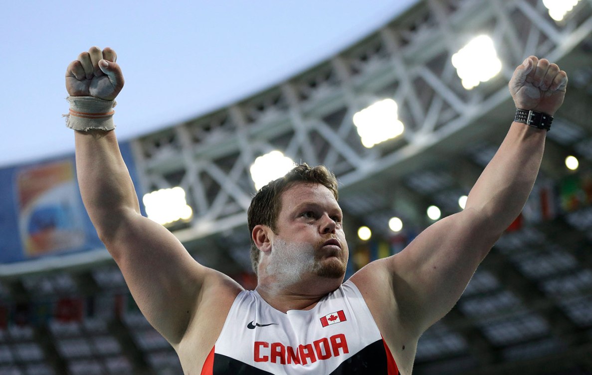 Armstrong reacts during the men's shot put final, for which he won the bronze medal, at the World Athletics Championships  Moscow, Russia, Friday, Aug. 16, 2013. (AP Photo/David J. Phillip)