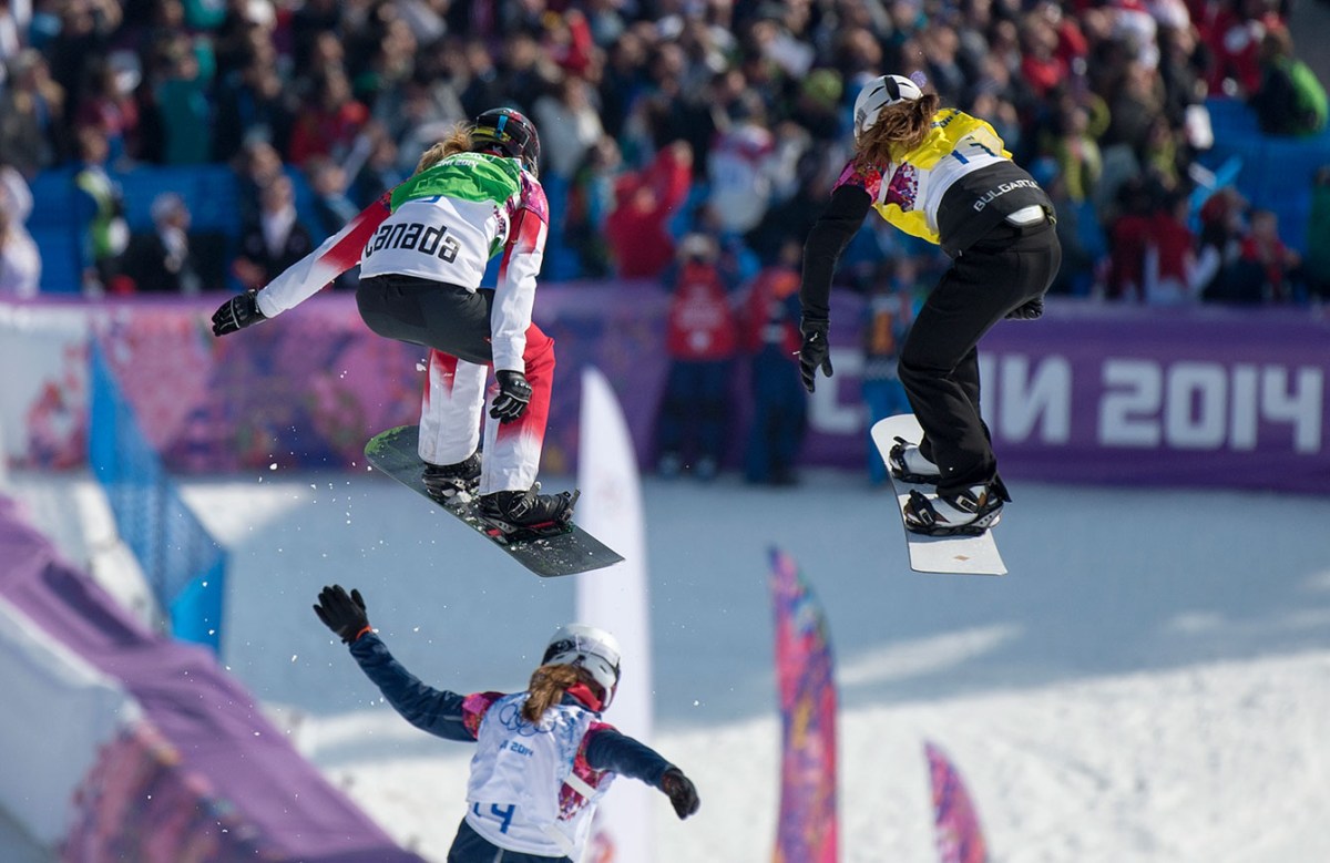 Snowboard cross racers near the finish line