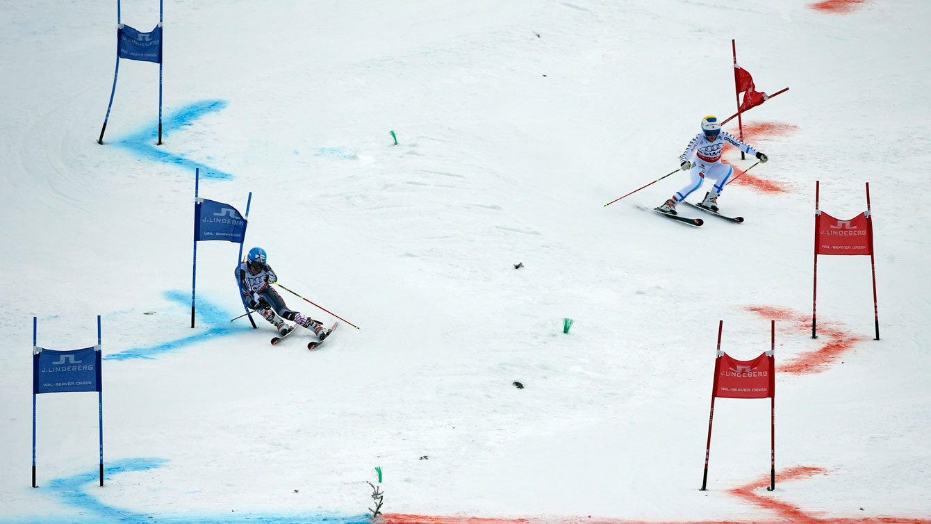 Erin Mielzynski (left) ahead of her Swedish opponent in the mixed team event at the 2015 FIS Alpine World Ski Championships. 