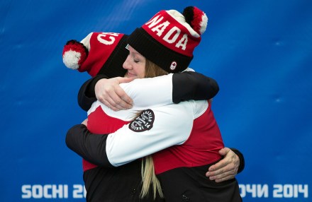 Kaillie Humphries and Heather Moyse at the victory ceremony for bobsleigh in Sochi.