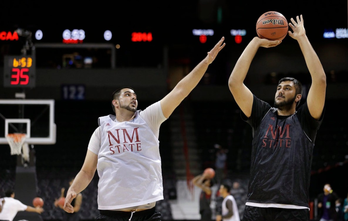 Tanveer Bhular, left, looks to block a shot by brother Sim in warmup.