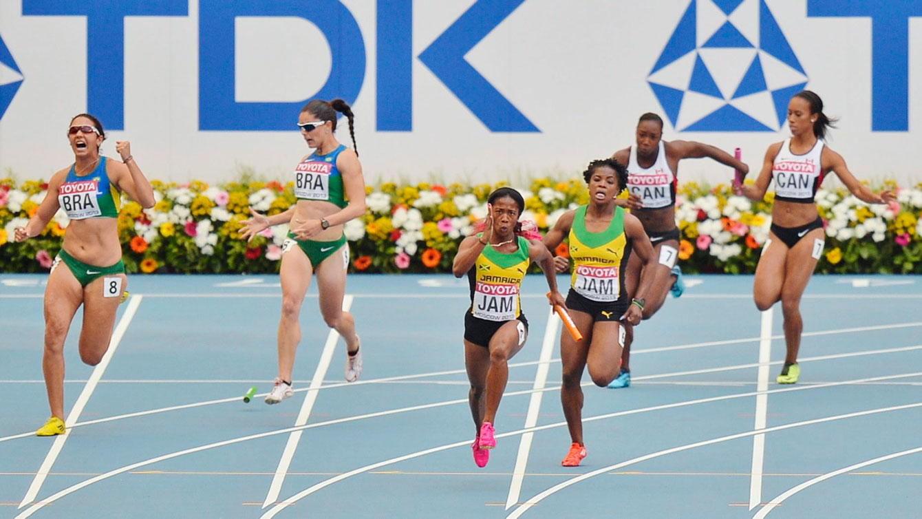 Brazil (left) drops the baton as Canadians and Jamaicans get away with clean exchanges at Moscow 2013, the IAAF World Athletics Championships. 