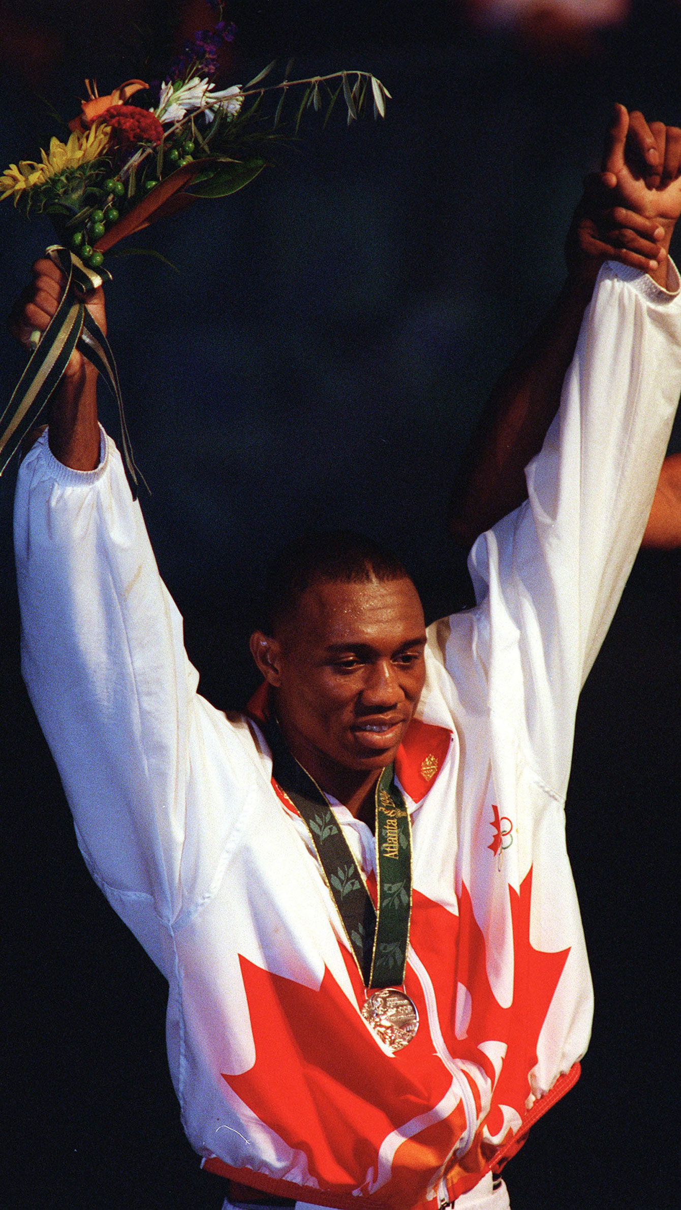 David Defiagbon receives his Olympic medal at Atlanta 1996. 