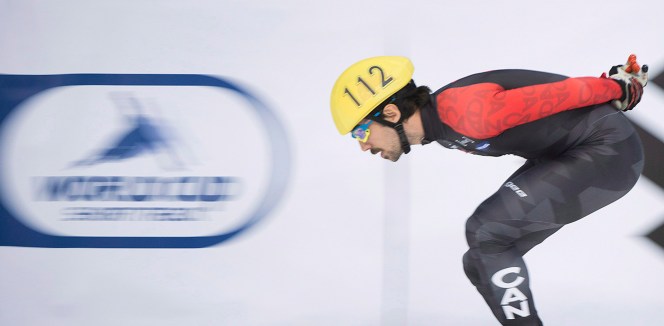 hamelin-3- Charles Hamelin from Canada warms up prior to competing in the men's 500-metre event at the ISU World Cup Short Track Speedskating competition in Montreal, Sunday, November 16, 2014. THE CANADIAN PRESS/Graham Hughes
