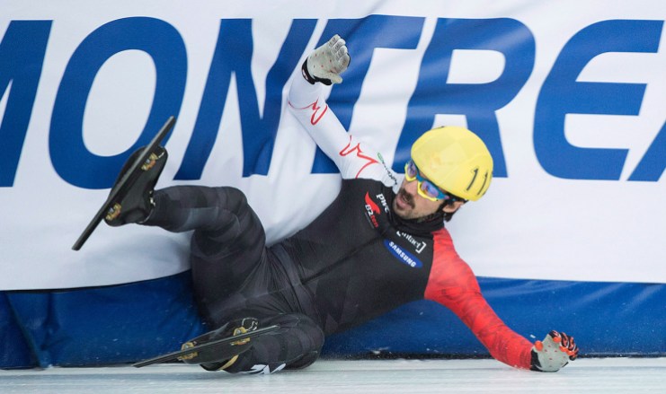 hamelin-5 Canadian Charles Hamelin crashes out of his 1,500-metre semifinal race at the ISU World Cup Short Track Speedskating competition in Montreal, Saturday, November 15, 2014. THE CANADIAN PRESS/Graham Hughes