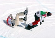Maltais sneaks around American Lindsey Jacobellis, in a snowboard cross semifinal at Sochi 2014.