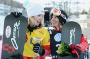 l-r Dominique Maltais of Canada (first place) and Maelle Ricker of Canada (third place) pose together at the FIS Snowboard Cross World Cup race at Blue Mountain in Collingwood, Ontario, Wednesday, February 8, 2012. THE CANADIAN PRESS/Dave Chidley