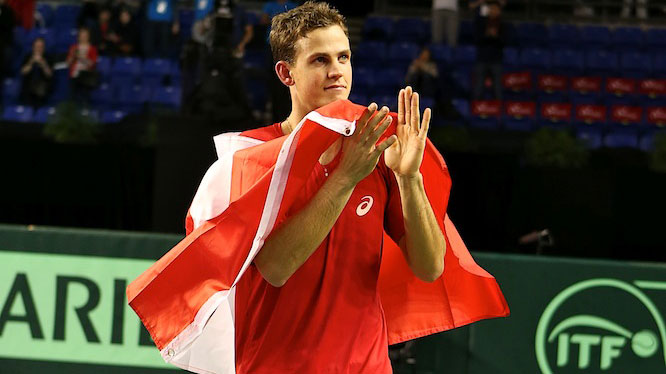 Vasek Pospisil did a victory lap with the Canadian flag following his 2015 Davis Cup fifth rubber win over Japan's Go Soeda.