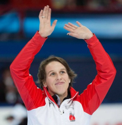 st-gelais-2- Marianne St-Gelais from Canada waves to fans after finishing second in the women's 500-metre final race at the ISU World Cup Short Track Speedskating competition in Montreal, Saturday, November 15, 2014. THE CANADIAN PRESS/Graham Hughes