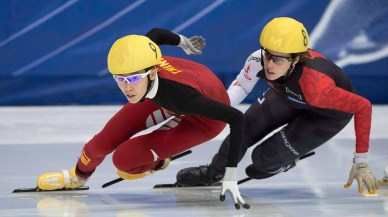 st-gelais-3- Fan Kexin from China (9) skates to a first place finish ahead of Marianne St-Gelais from Canada during the women's 500-metre final race at the ISU World Cup Short Track Speedskating competition in Montreal, Saturday, November 15, 2014. THE CANADIAN PRESS/Graham Hughes