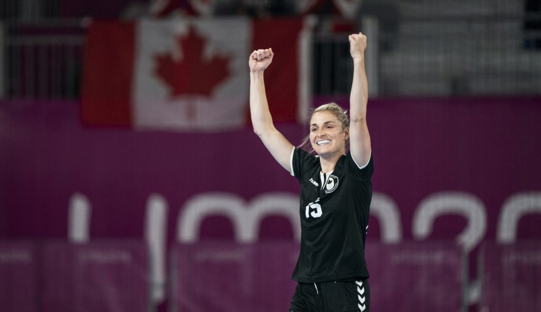 Audrey Marcoux celebrates with arms raised