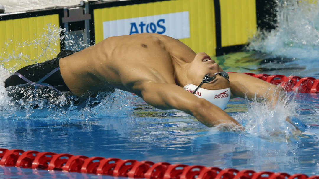 Markus dives into the pool to start a backstroke race.