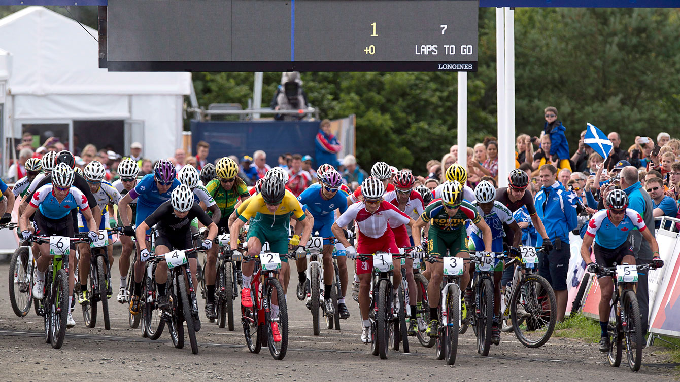 Canada's Max Plaxton, left and Raphael Gagne, right start in the men's cross-country event at Cathkin Braes mountain bike trails at the Commonwealth Games in Glasgow, Scotland on Tuesday, July 29, 2014. THE CANADIAN PRESS/Andrew Vaughan