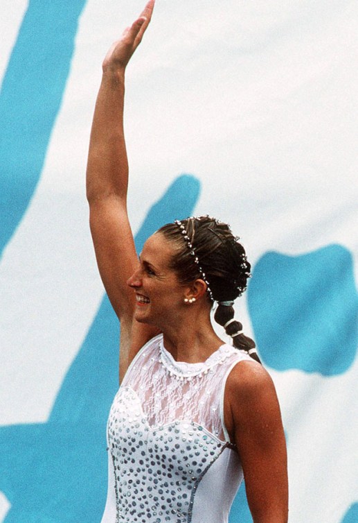Sylvie Fréchette celebrates her silver finish, later awarded gold after a judging error at the Barcelona 1992 Olympic games