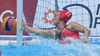 Water polo goalkeeper makes a save