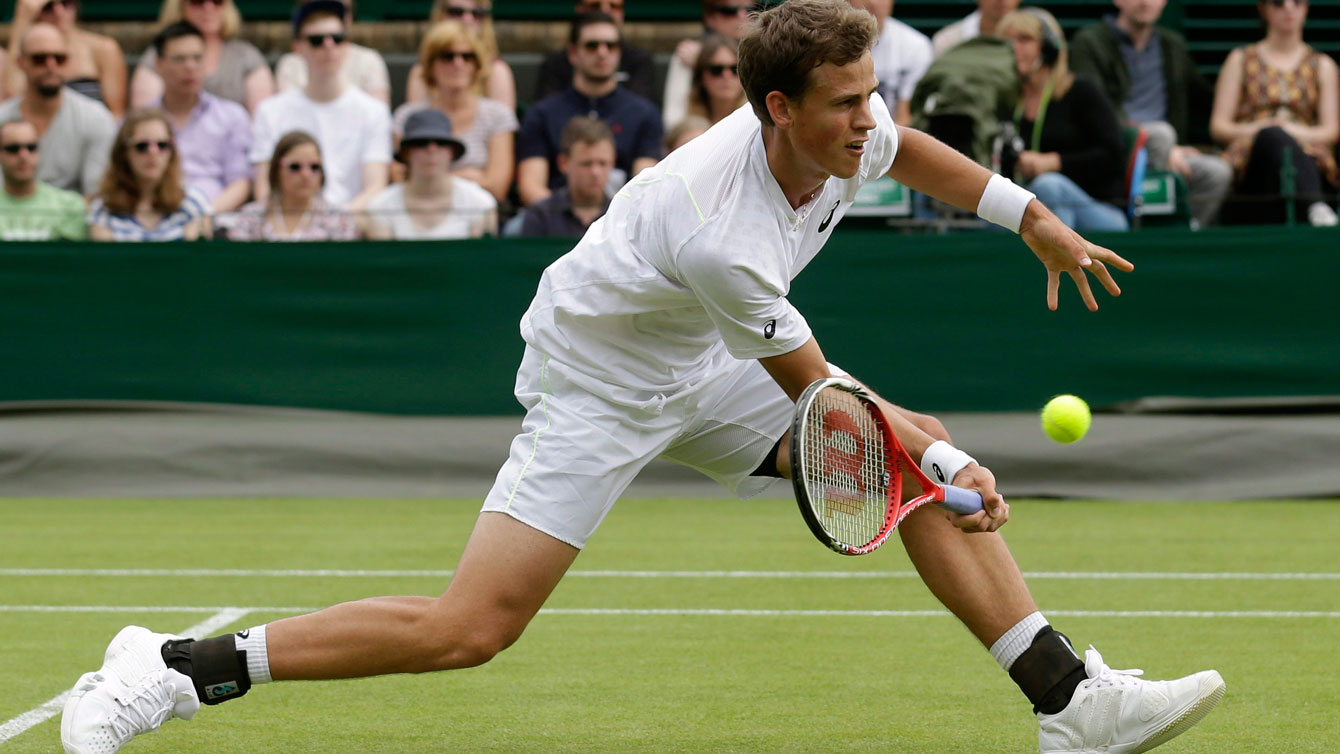 Vasek Pospisil in action at Wimbledon in 2013.
