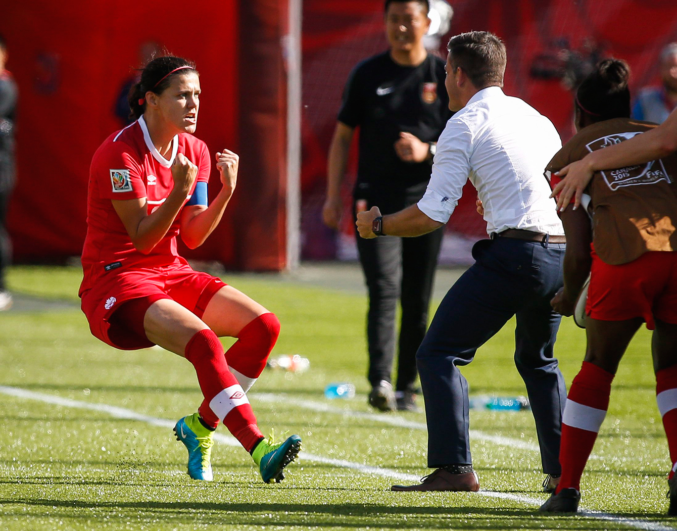 Christine Sinclair and coach John Herdman celebrate the penalty winner in the FIFA Women's World Cup opener on June 6, 2015. 