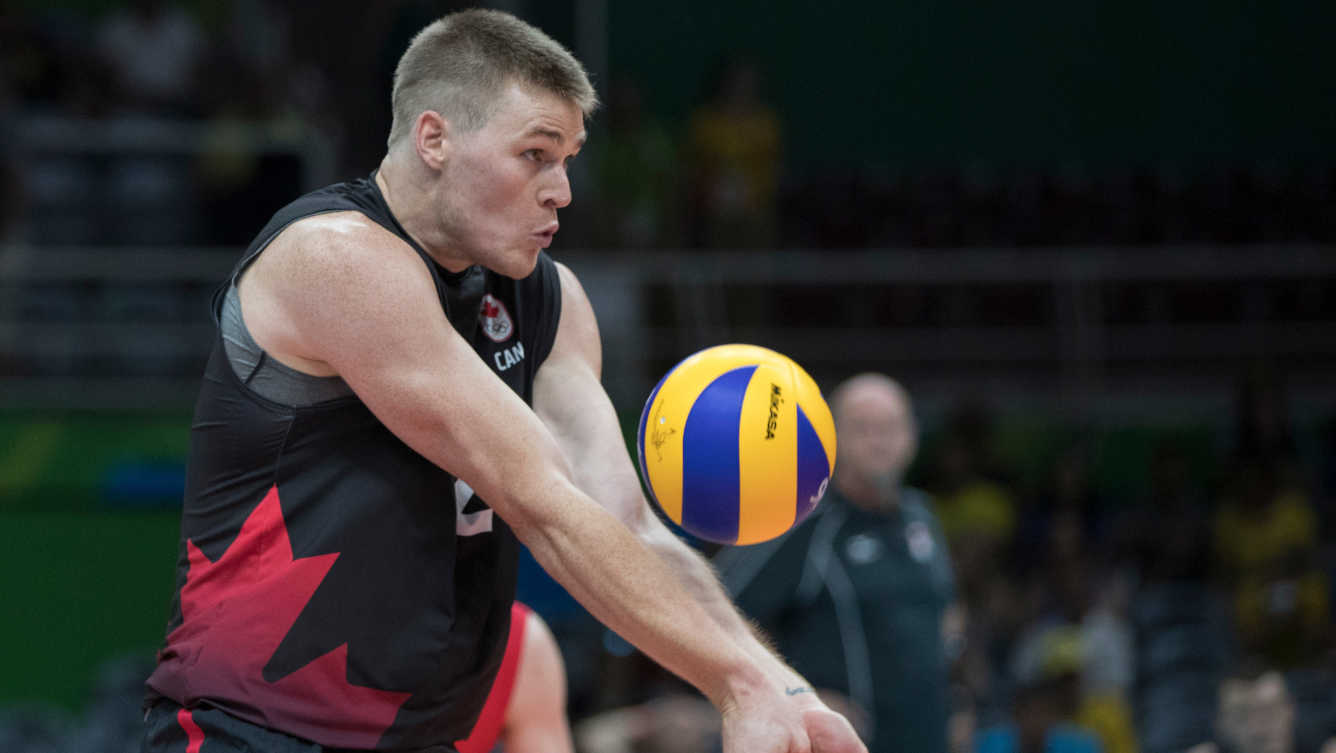 Canada's Gord Perrin bumps the ball