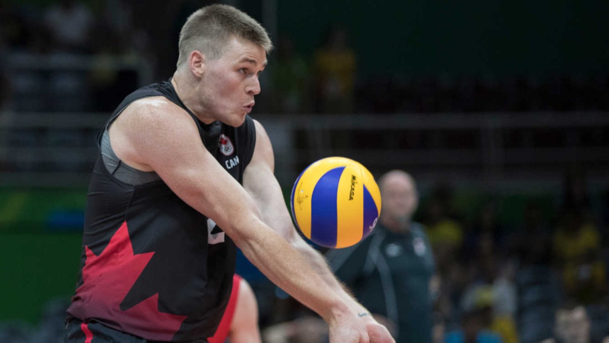 Canada's Gord Perrin bumps the ball