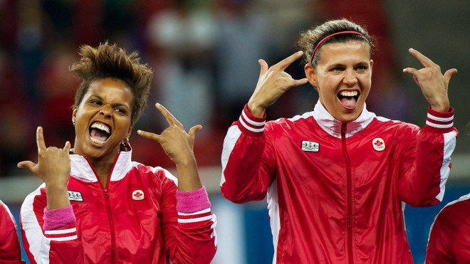 Goalkeeper Karina Leblanc (left) and captain Christine Sinclair react after winning the gold medal in Guadalajara 2011