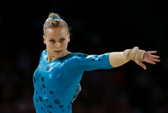 Canada's Ellie Black performs the floor exercise during women's artistic gymnastics all-around competition in the Pan Am Games in Toronto, Monday, July 13, 2015. Black won the gold medal in the event. (AP Photo/Gregory Bull)